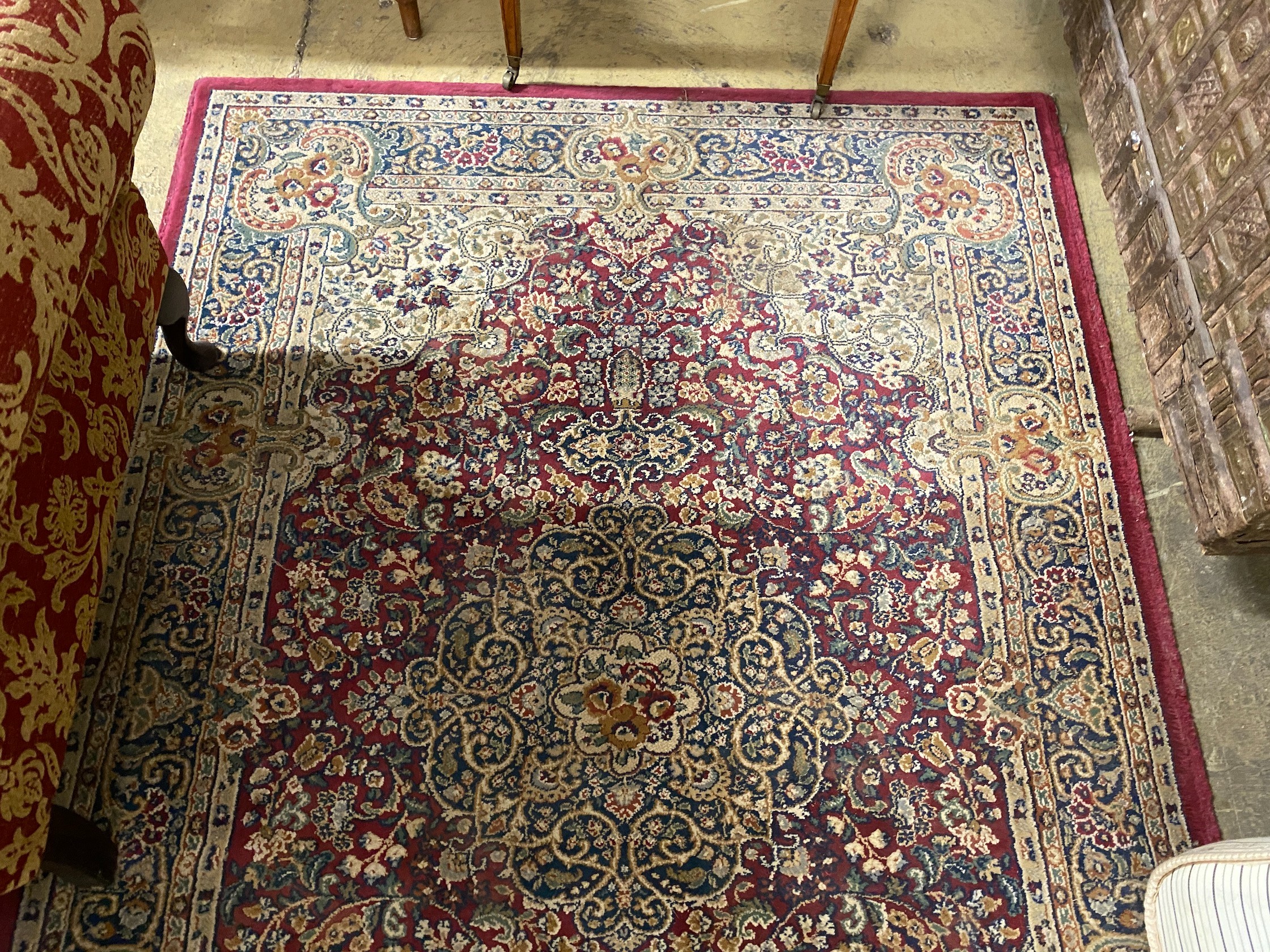 A Persian style burgundy ground machined rug, 196 x 137cm